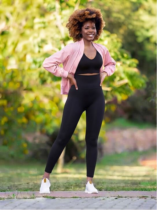 Lifestyle shot of High-Waisted Shaping Leggings outdoors