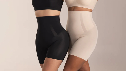 Two women wearing Shapermint Everyday Empower High-Waisted Shaper Shorts in black and nude